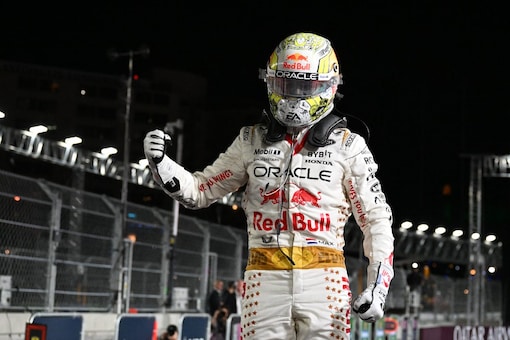 Verstappen in his Elvis-themed racing suit celebrating his win. (Credit: AFP)